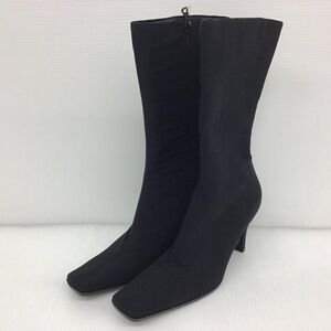 Black nylon Prada heeled boots.